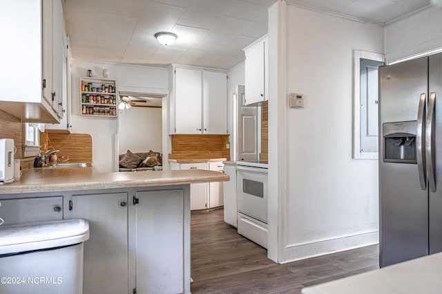 kitchen featuring white cabinets, dark hardwood / wood-style flooring, stainless steel refrigerator with ice dispenser, sink, and white range