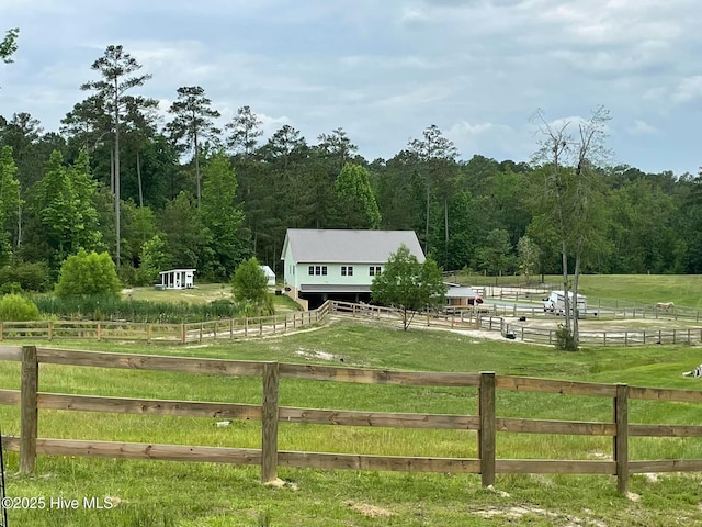 exterior space featuring an outdoor structure and a rural view