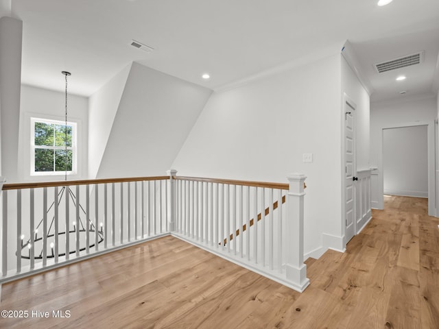 103 Cumberland St, Newport, NC 28570 - hallway with an upstairs landing, wood finished floors, a chandelier, and recessed lighting