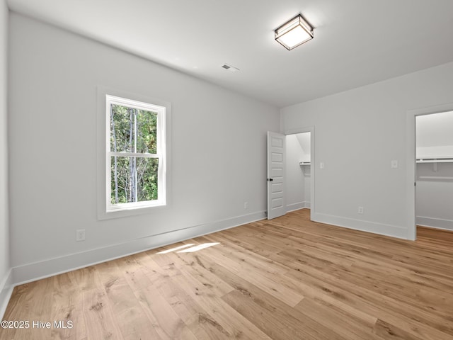 103 Cumberland St, Newport, NC 28570 - unfurnished bedroom with a spacious closet, light wood-style flooring, and a closet
