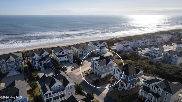 aerial view featuring a view of the beach and a water view