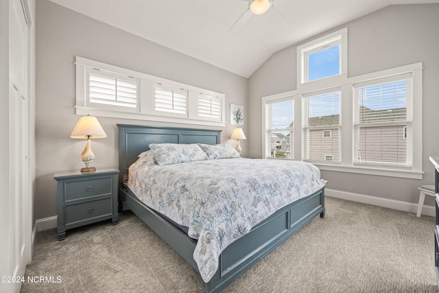 carpeted bedroom featuring vaulted ceiling and ceiling fan