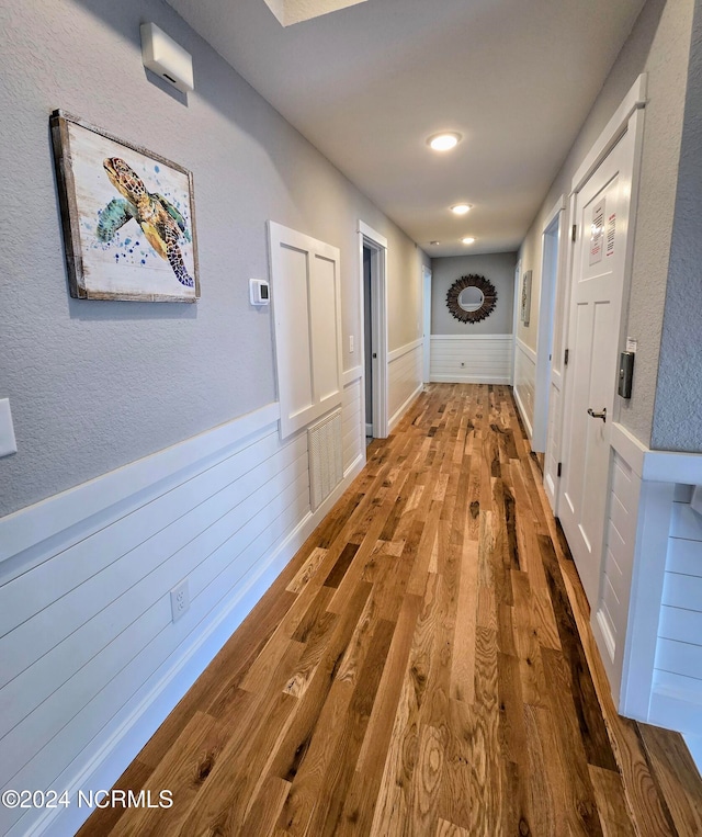 hallway featuring wood-type flooring