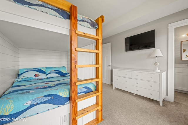 carpeted bedroom with ensuite bathroom