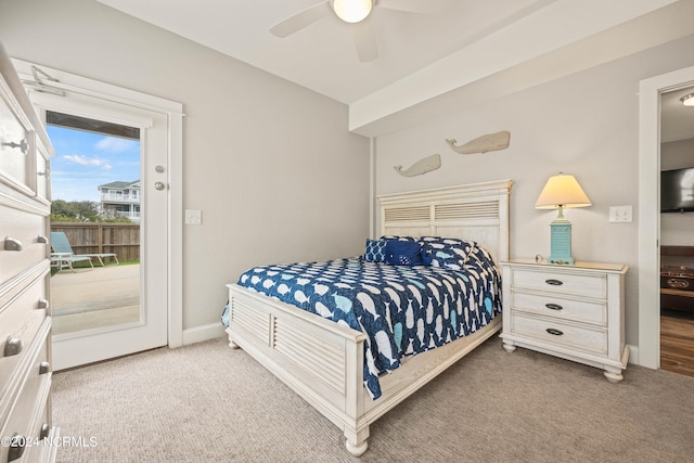 carpeted bedroom with ceiling fan and access to outside