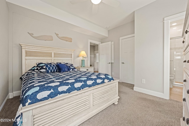 bedroom with carpet, ceiling fan, and connected bathroom