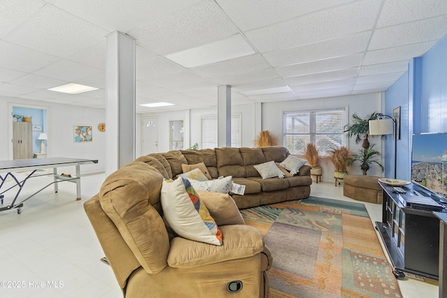 living room with a drop ceiling