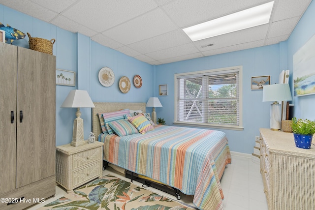 bedroom featuring a paneled ceiling