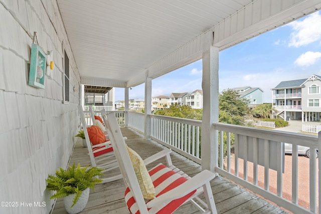 wooden deck featuring covered porch