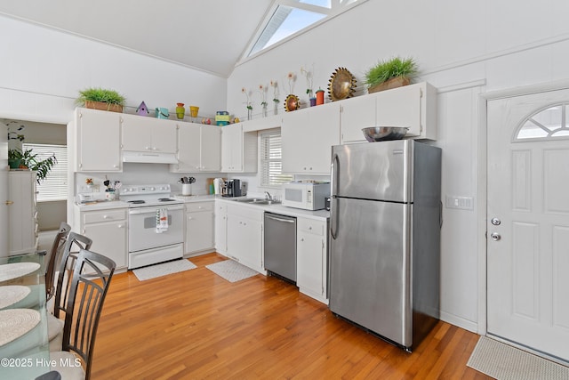 kitchen featuring sink, stainless steel appliances, light hardwood / wood-style floors, and white cabinets