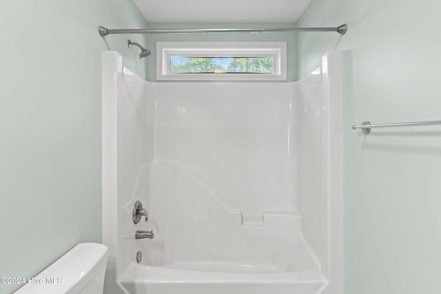 full bathroom featuring shower / tub combination and toilet