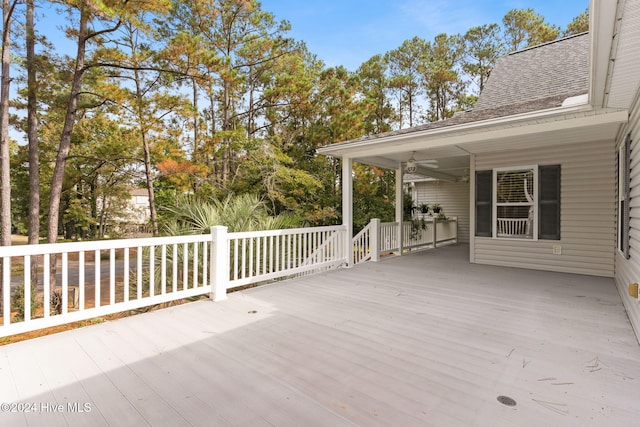 wooden deck featuring a ceiling fan