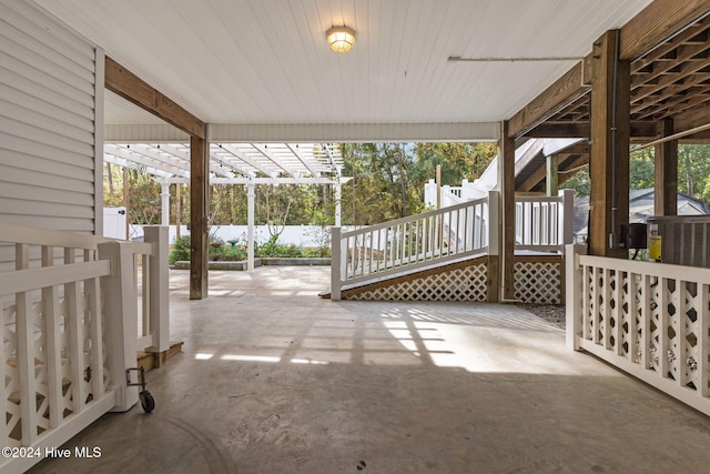 view of patio featuring fence and a wooden deck