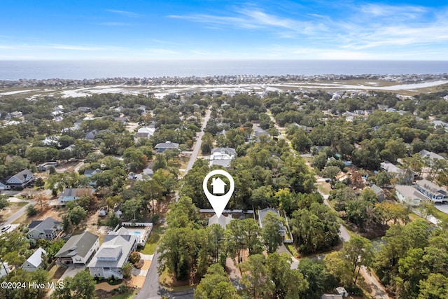 birds eye view of property with a water view and a residential view