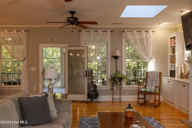 interior space with a skylight and ceiling fan