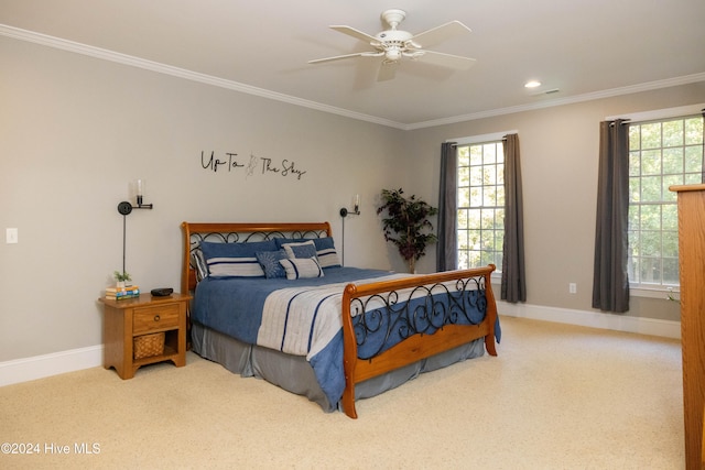 bedroom with ceiling fan, carpet flooring, and ornamental molding