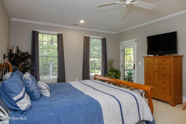 carpeted bedroom featuring ceiling fan, crown molding, access to outside, and multiple windows