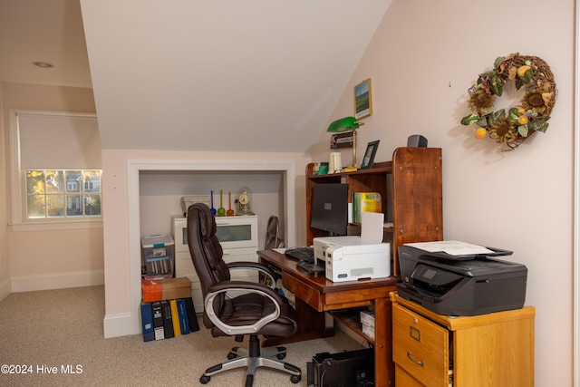 office area featuring lofted ceiling and carpet flooring