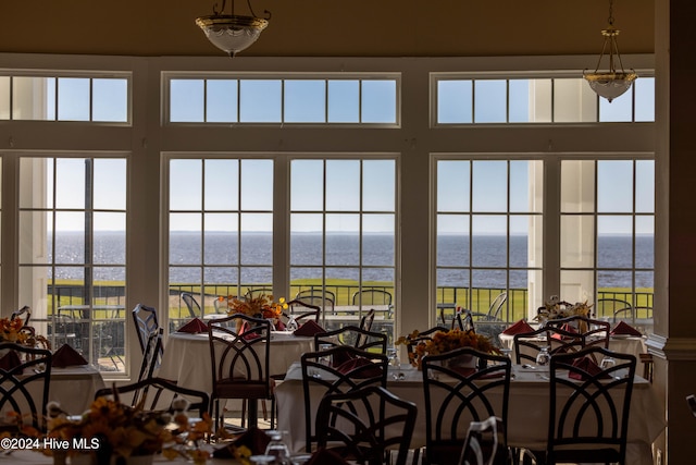 dining area featuring a water view