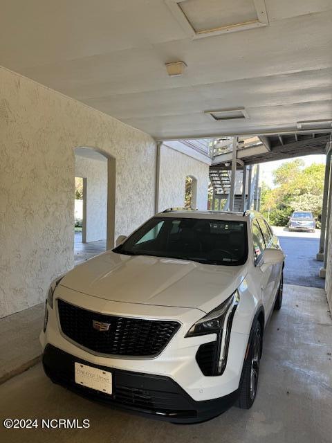 garage featuring a carport