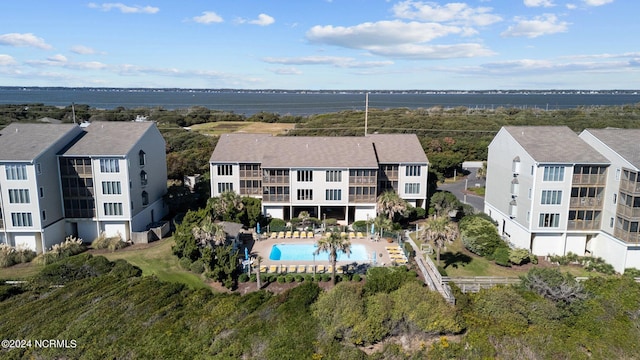 birds eye view of property featuring a water view