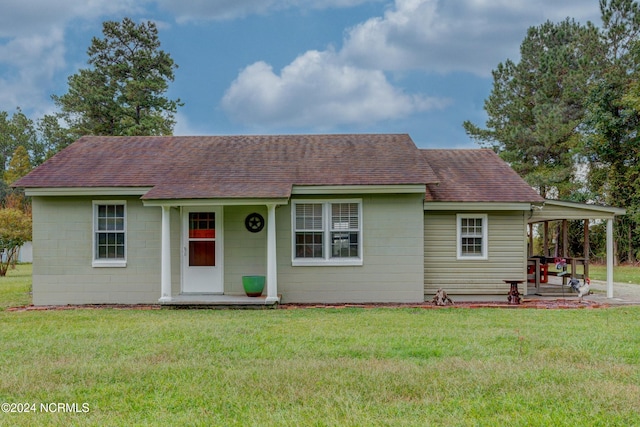 view of front of property with a front lawn and a patio area