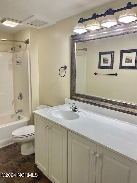 full bathroom featuring toilet, shower / washtub combination, and vanity