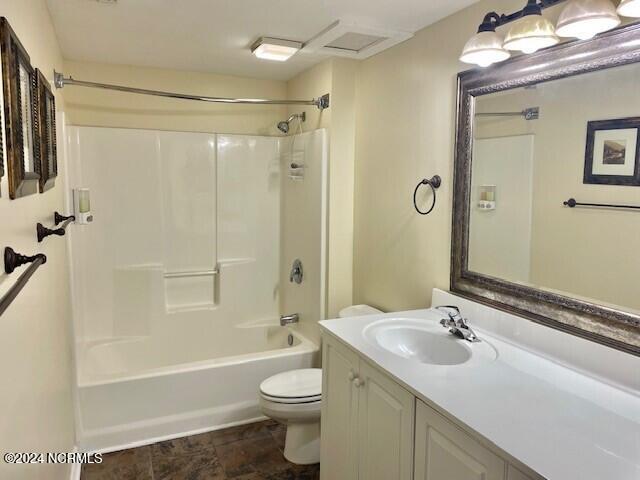 full bathroom featuring vanity, toilet, and washtub / shower combination