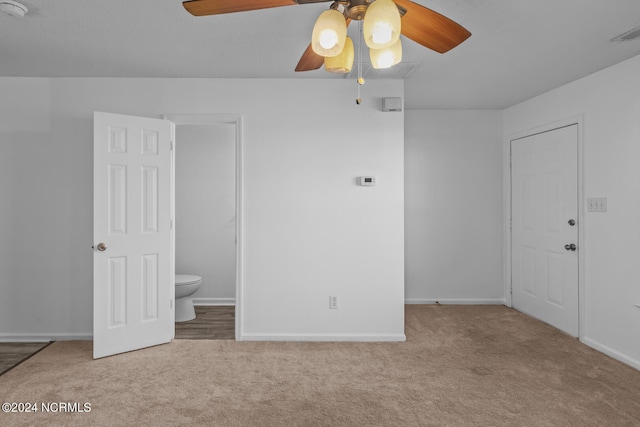 interior space with ceiling fan