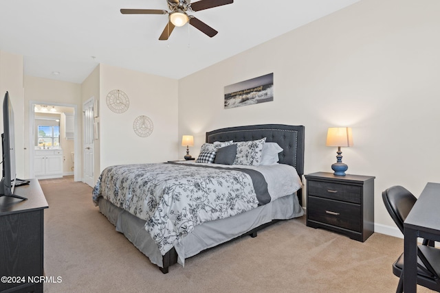 carpeted bedroom featuring ensuite bathroom and ceiling fan