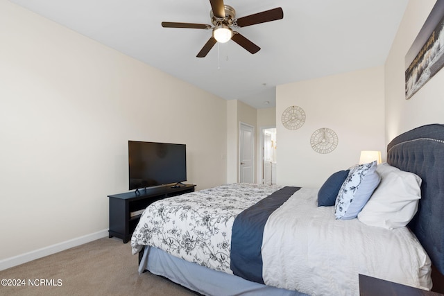 bedroom with light carpet and ceiling fan