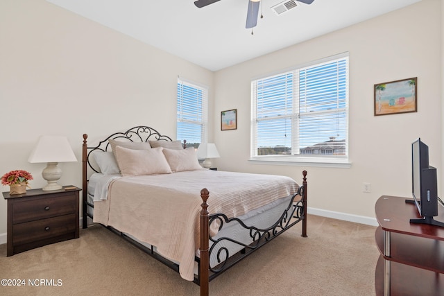 carpeted bedroom featuring ceiling fan