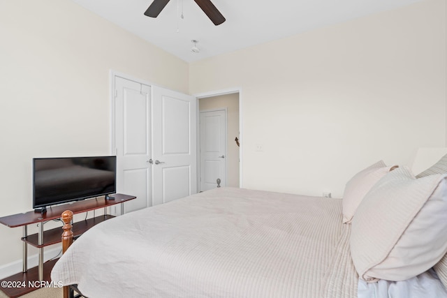 bedroom featuring a closet, ceiling fan, and hardwood / wood-style floors