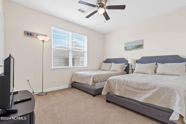 bedroom featuring ceiling fan and light colored carpet