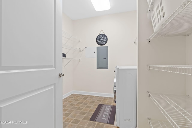 laundry room featuring washer / dryer and electric panel