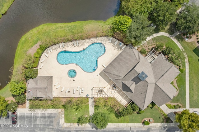 birds eye view of property featuring a water view