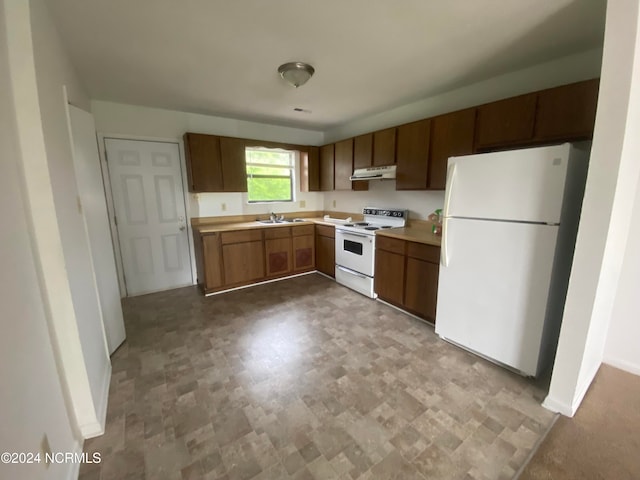 kitchen with sink and white appliances