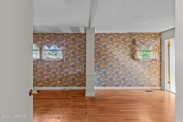 124 N Lisk Dr, Swansboro, NC 28584 - basement featuring plenty of natural light, baseboards, wood finished floors, and visible vents