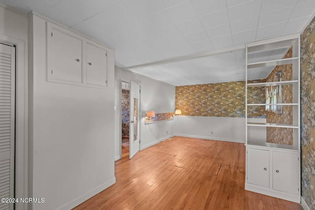 unfurnished dining area with light wood-type flooring