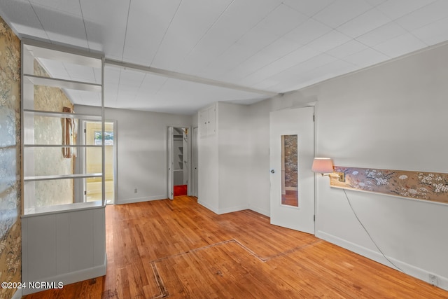 empty room with light hardwood / wood-style floors