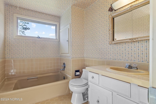 124 N Lisk Dr, Swansboro, NC 28584 - full bath with wainscoting, tile patterned flooring, toilet, a washtub, and wallpapered walls