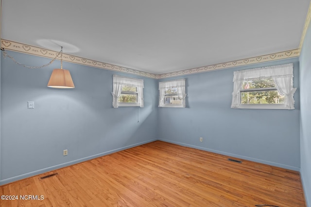 124 N Lisk Dr, Swansboro, NC 28584 - spare room featuring visible vents, baseboards, and wood finished floors