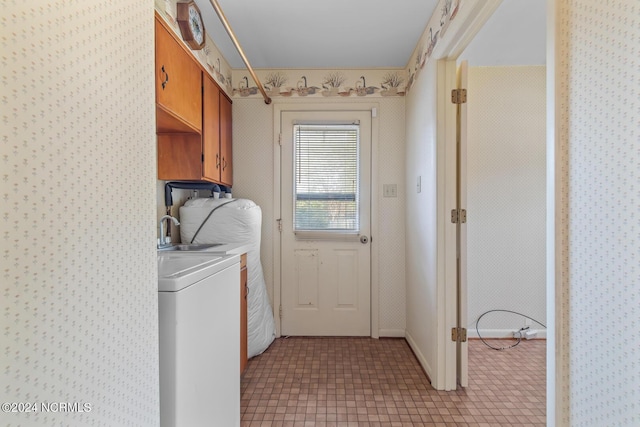 124 N Lisk Dr, Swansboro, NC 28584 - washroom featuring cabinet space, wallpapered walls, and washer and clothes dryer