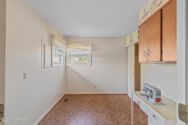 124 N Lisk Dr, Swansboro, NC 28584 - kitchen featuring baseboards, light countertops, and visible vents