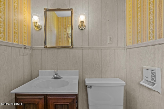 124 N Lisk Dr, Swansboro, NC 28584 - bathroom with vanity, wainscoting, toilet, and wallpapered walls