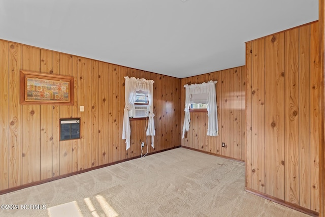 124 N Lisk Dr, Swansboro, NC 28584 - unfurnished room with carpet floors, heating unit, baseboards, and wooden walls