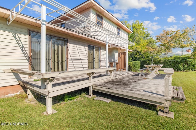 wooden terrace with a yard