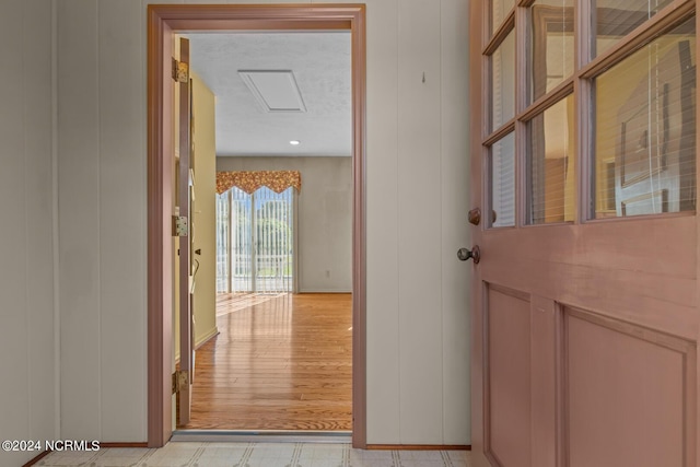 124 N Lisk Dr, Swansboro, NC 28584 - corridor featuring baseboards and attic access