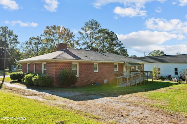 view of home's exterior with a lawn