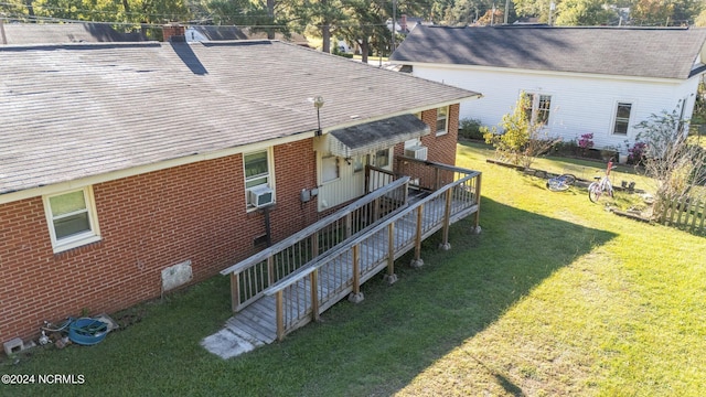 back of house featuring a lawn